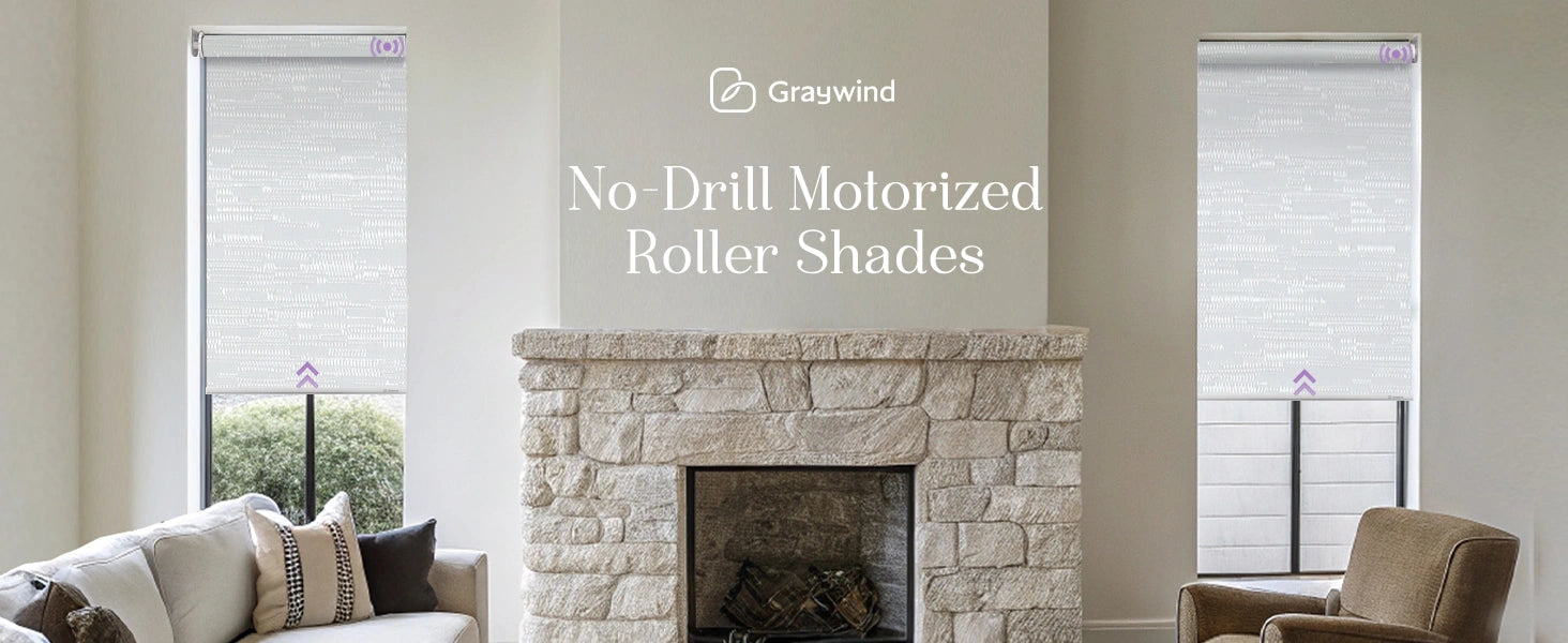 Living room with stone fireplace and no drill roller shades, featuring Graywind branding.