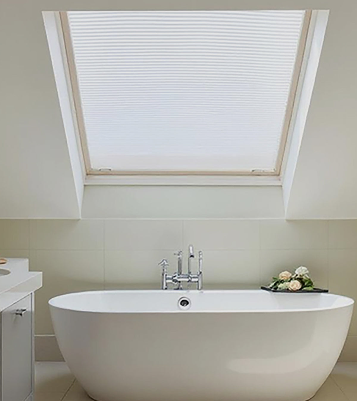 Modern bathroom with a freestanding bathtub and skylight