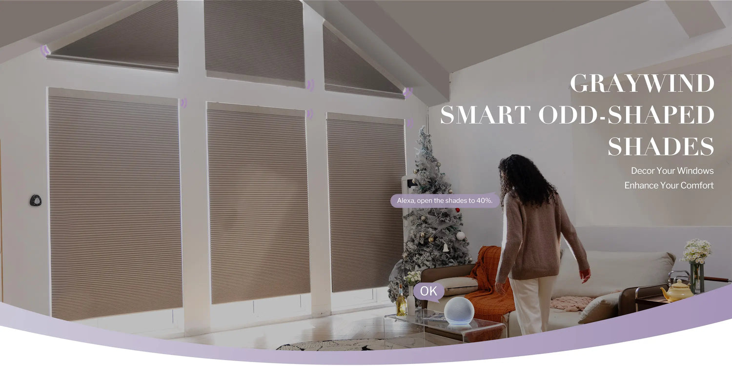 Living room with shaped shades and a woman standing near a Christmas tree, text "graywind smart odd-shaped shades" in the right part of the image.