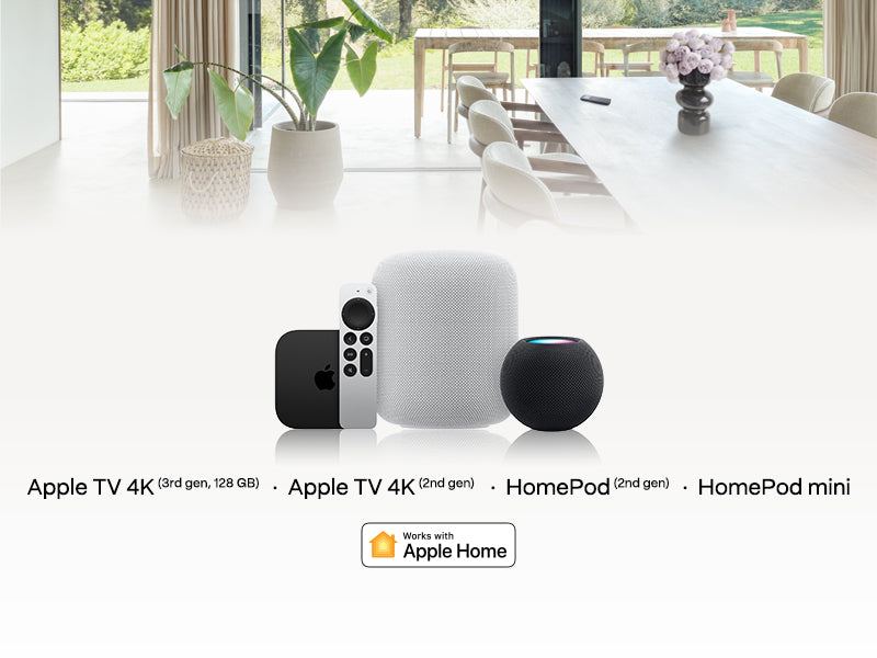 Apple TV 4K, HomePod, and HomePod mini on a white table with a modern interior background.