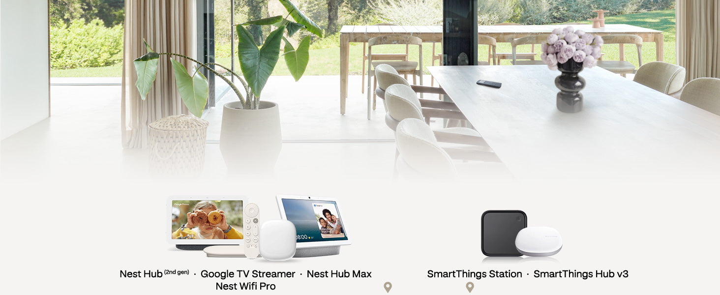 Modern living room with a white table and chairs, featuring Google and SamSung smart home devices.