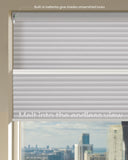 Window with motorized blinds showing a cityscape view