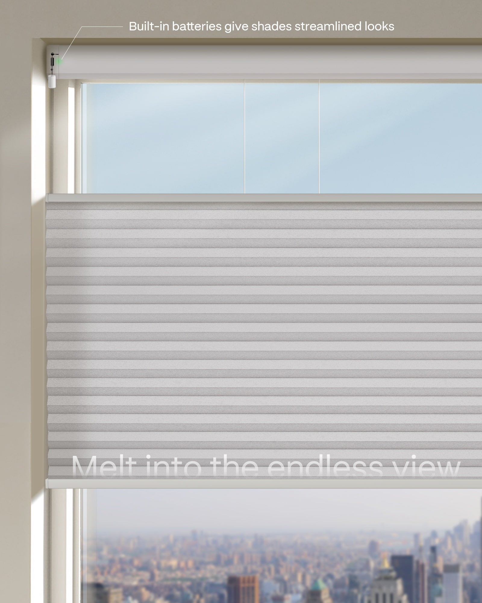 Window with light gray blinds and a cityscape view, featuring text about built-in batteries.