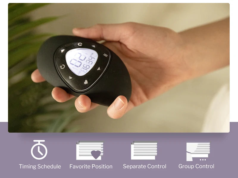 Hand holding a black electronic device with digital display, surrounded by greenery.