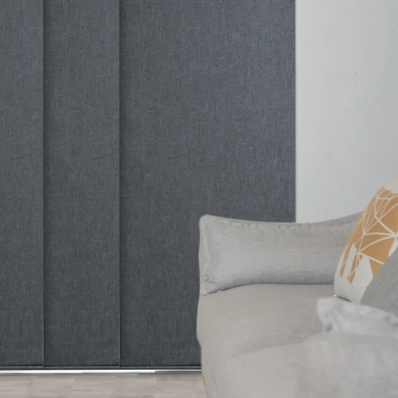 A living room with gray Panel Track Blinds.