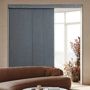 A living room with Panel Track Blinds.