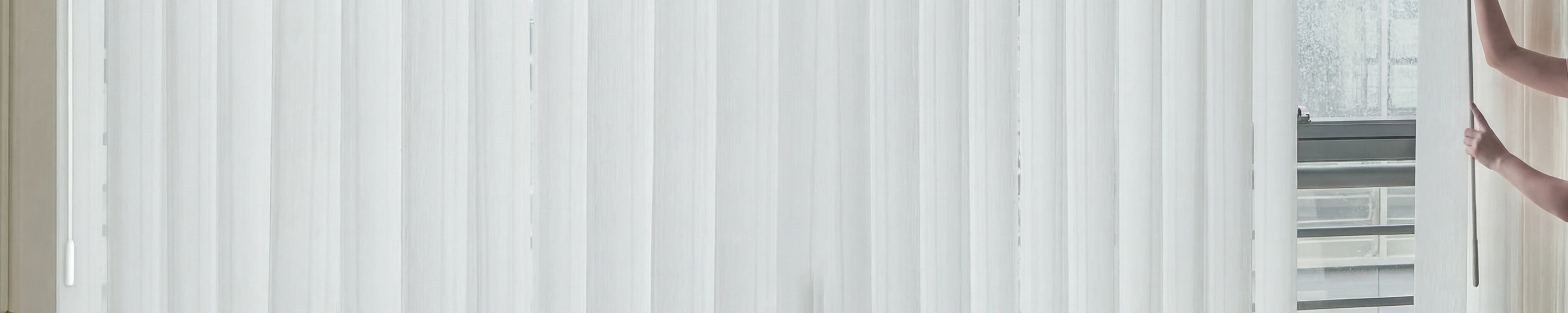 Manual vertical blinds with a blurred background