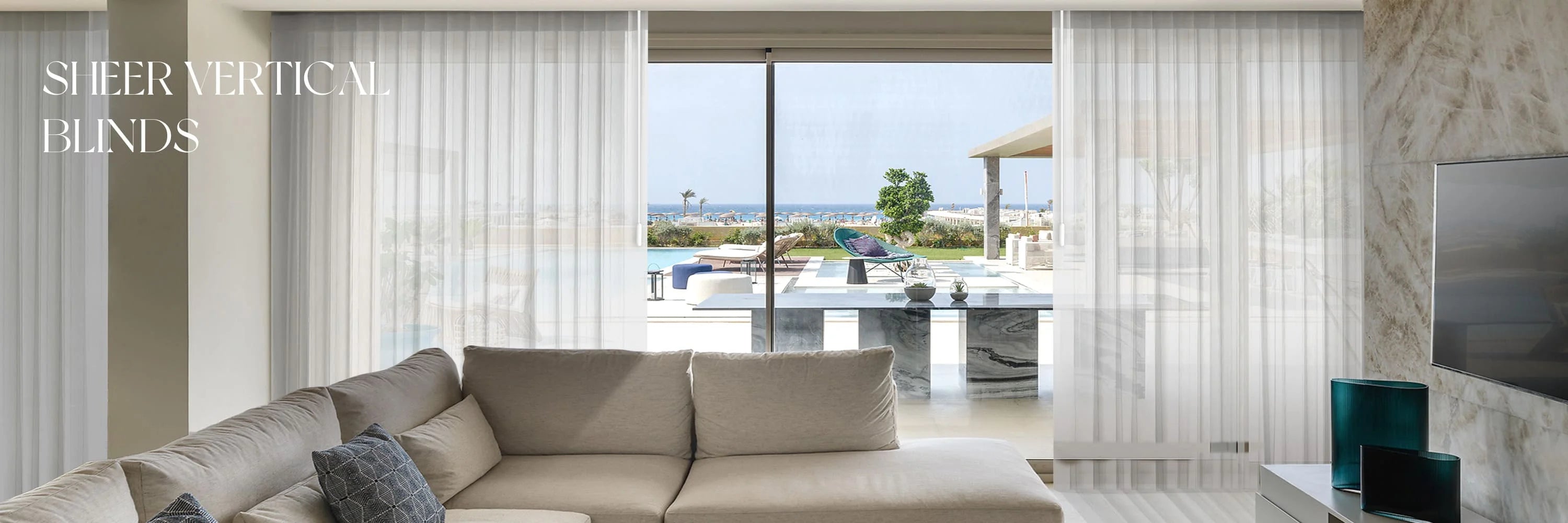 Living room with sheer vertical blinds and a view of a pool and garden.