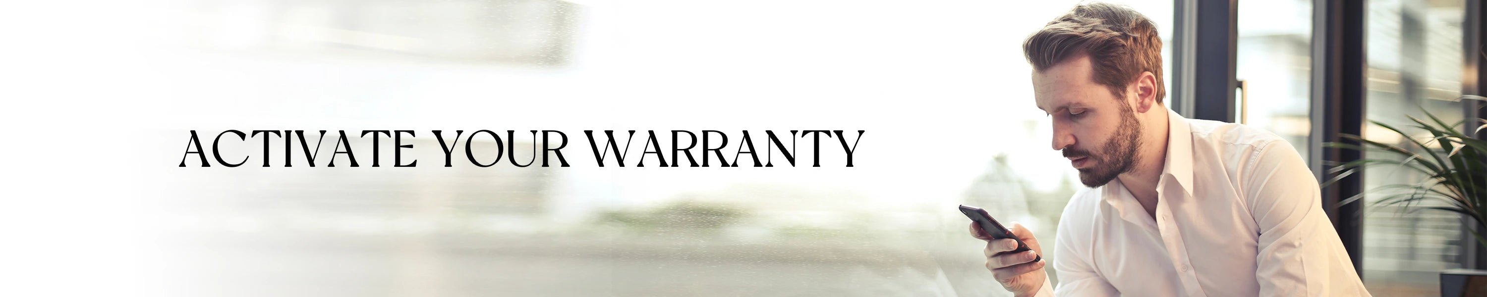 Man using a smartphone with text 'Activate Your Warranty' in an office setting