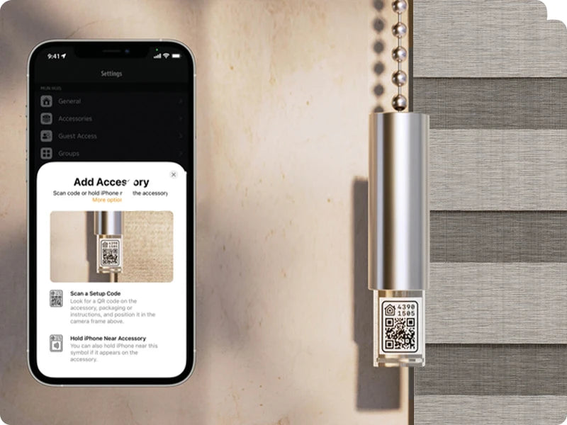 Smartphone displaying an accessory setup screen next to a metallic cylindrical device with a QR code on a textured surface.